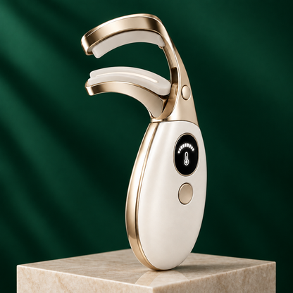 Eyelash curler on pale plinth with emerald green background
