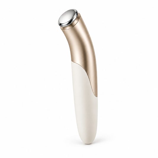 Slim ivory and champagne-gold beauty wand on white background