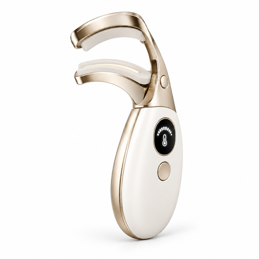 Pearl-white and gold-tone eyelash curler on white background